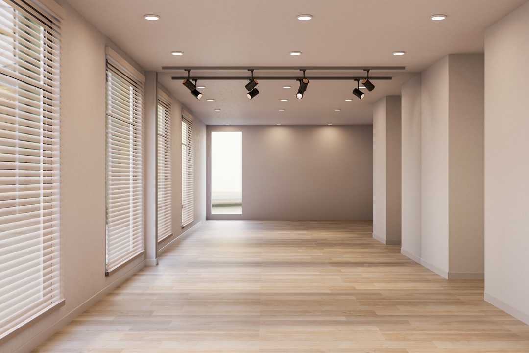 Cedar venetian blinds on floor-to-ceiling windows in a modern room with timber parquet flooring