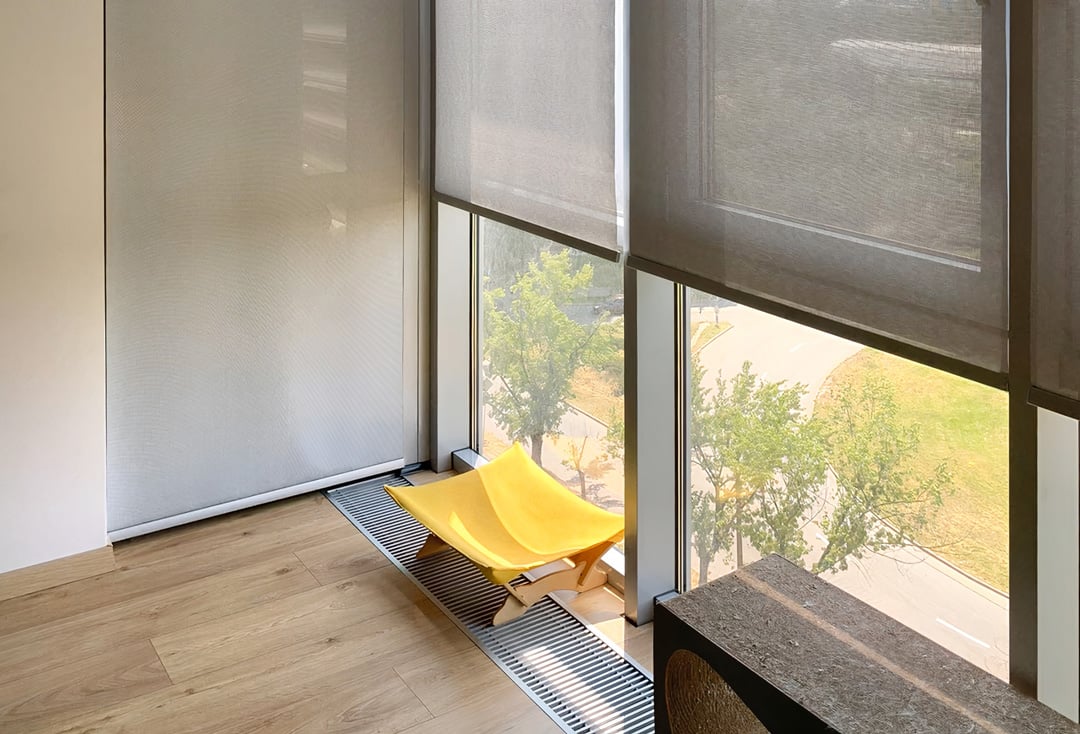 Automatic solar shades on full height windows