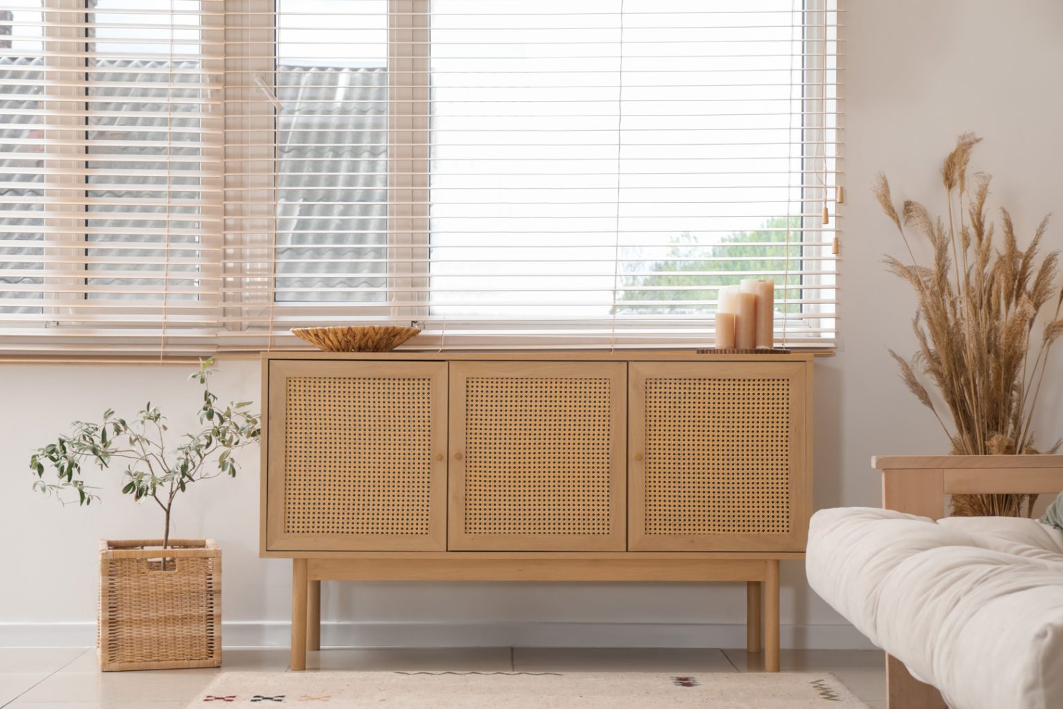 Modern living room with wooden chest of drawers and durable PVC Venetian window blinds