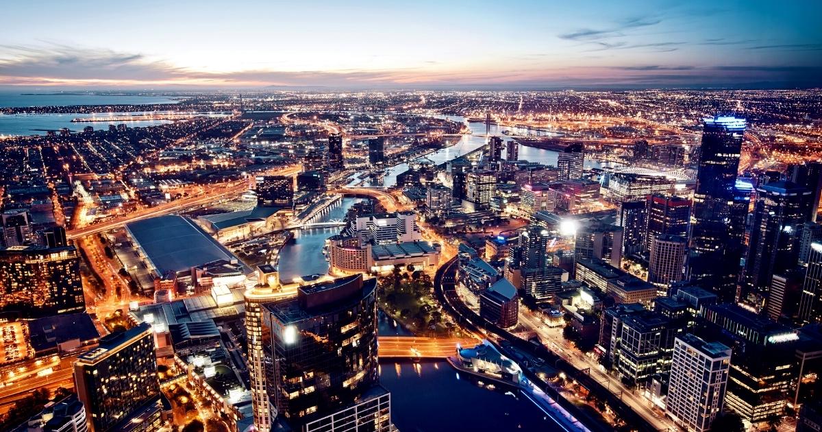 Wide aerial view of the Melbourne city skyline at night