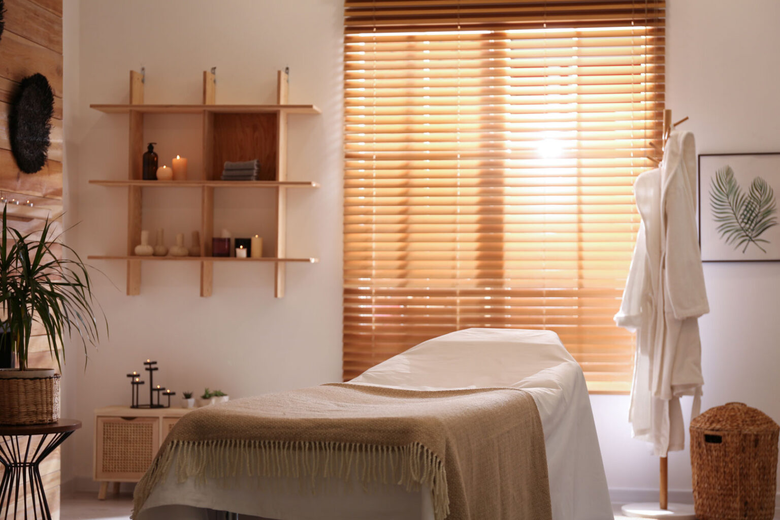 A light-wood venetian blinds that filter soft, warm sunlight.
