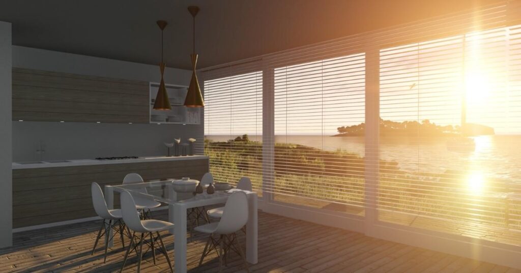 Modern kitchen and dining area with large windows and venetian blinds