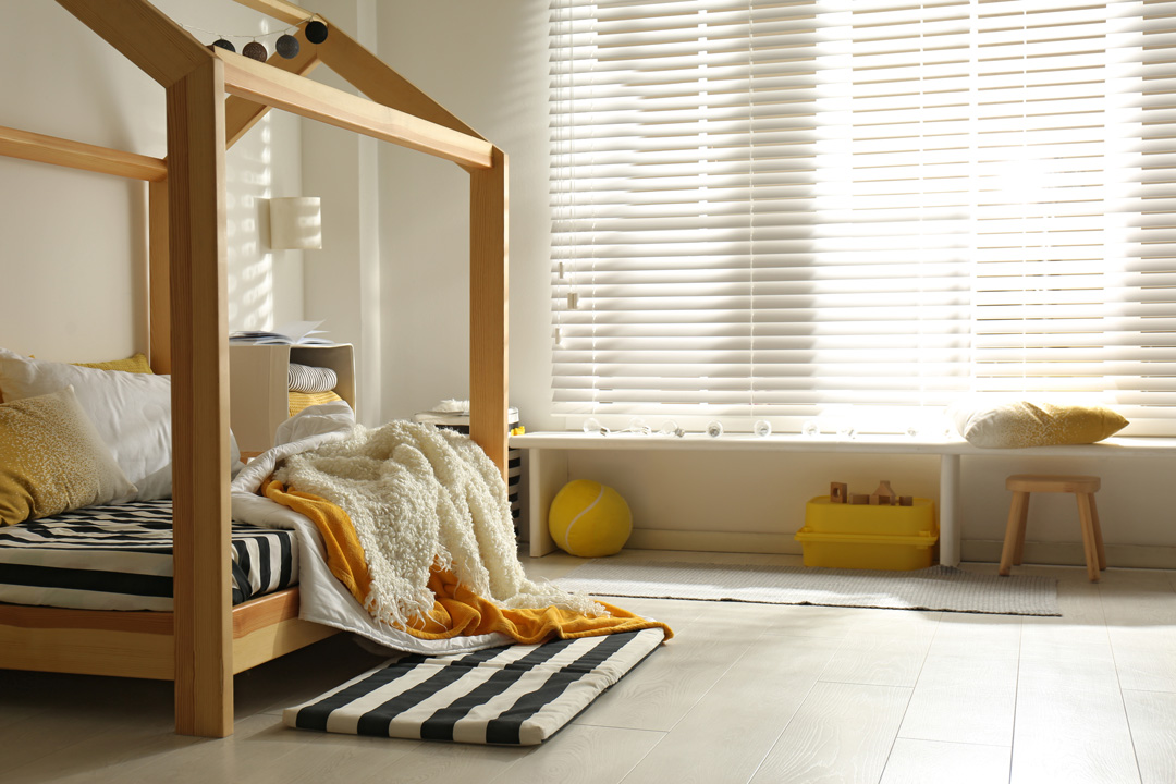 Cosy child room interior with comfortable bed