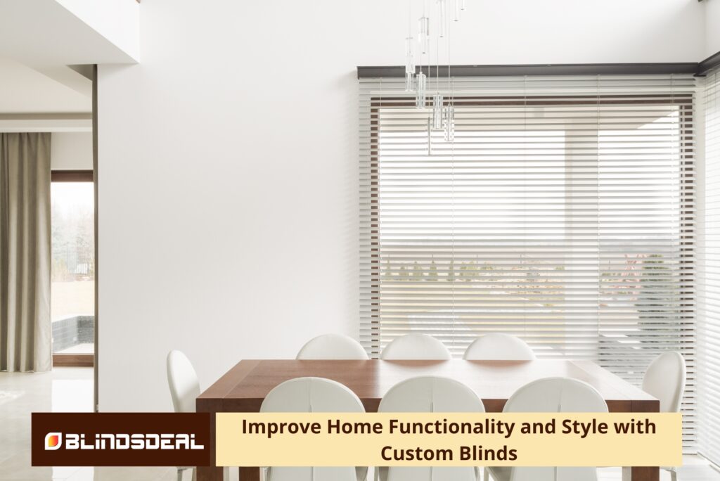 A large window covered by white horizontal blinds.