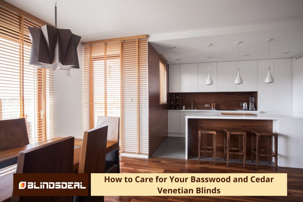 A modern kitchen and dining area featuring large windows fitted with light wood Venetian blinds.