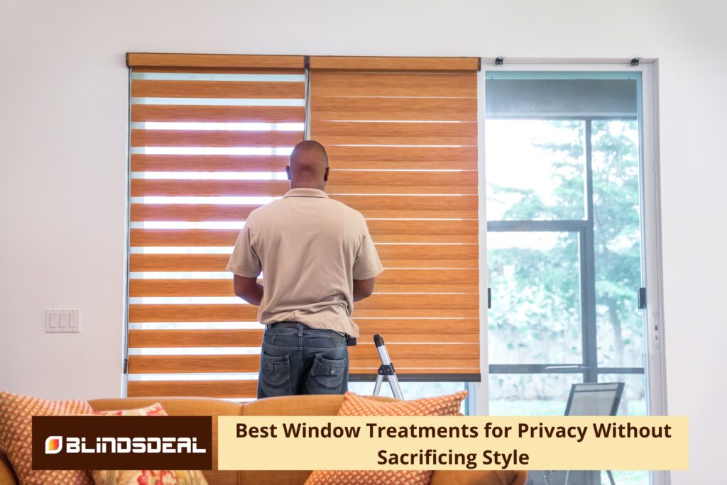 A man from behind stands in front of a window installing wood-toned zebra or dual-layered roller blinds