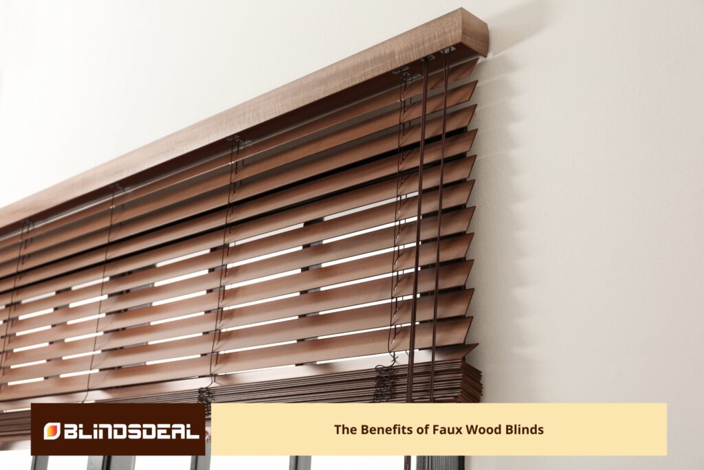A close-up of wooden blinds with a natural finish, showing the individual slats and cords.