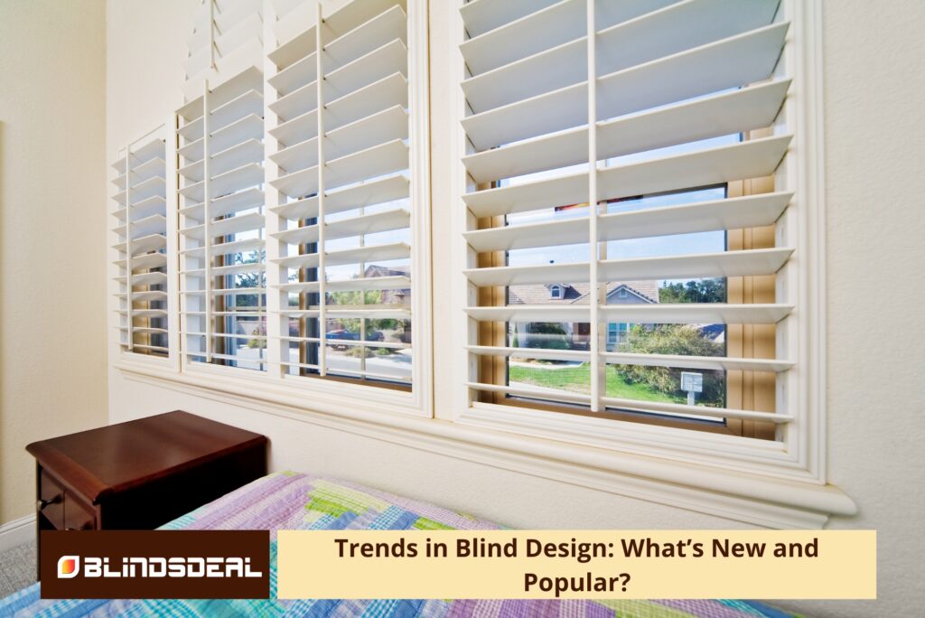 A close-up view of white plantation shutters on a large window in a bedroom