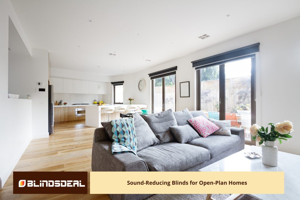 A dark roller blinds above the large glass doors