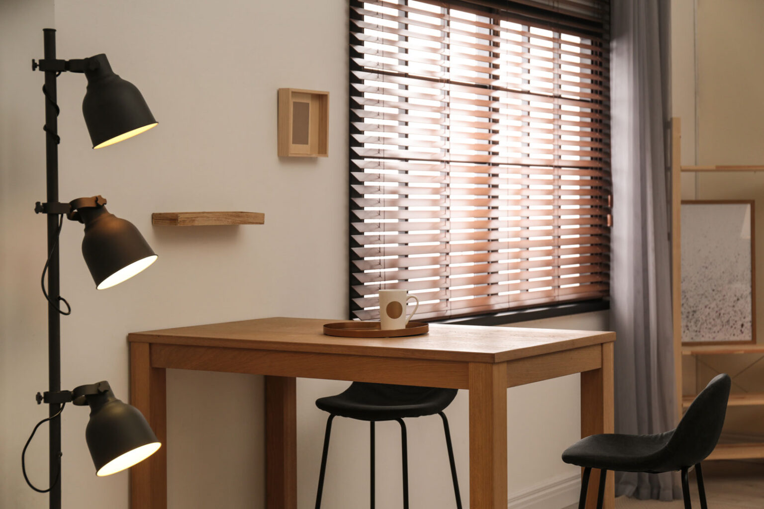 Modern room interior with table set, window blinds