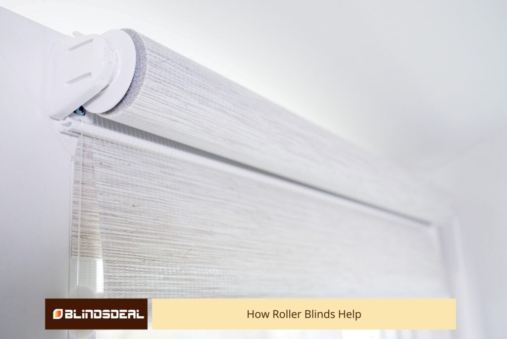A close-up shot of a textured light-grey roller blind mechanism mounted on a white wall.