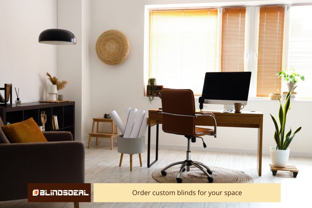 Sunlit home office featuring wooden Venetian blinds on large windows