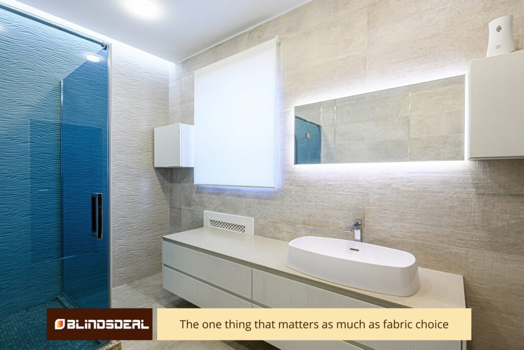 Contemporary bathroom with a sleek white roller blind installed above a modern vanity and large vessel sink, adjacent to a glass shower.