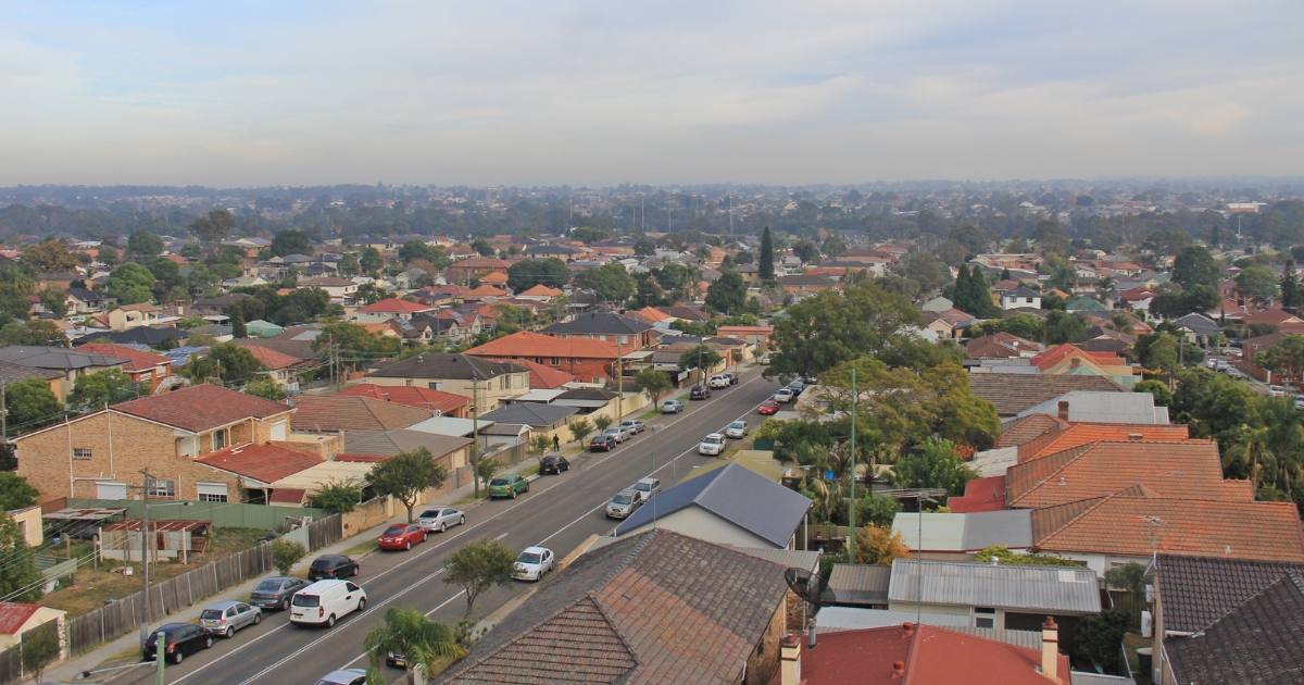 Elevated, wide-angle view of a sprawling suburban neighborhood in Auburn with residential houses